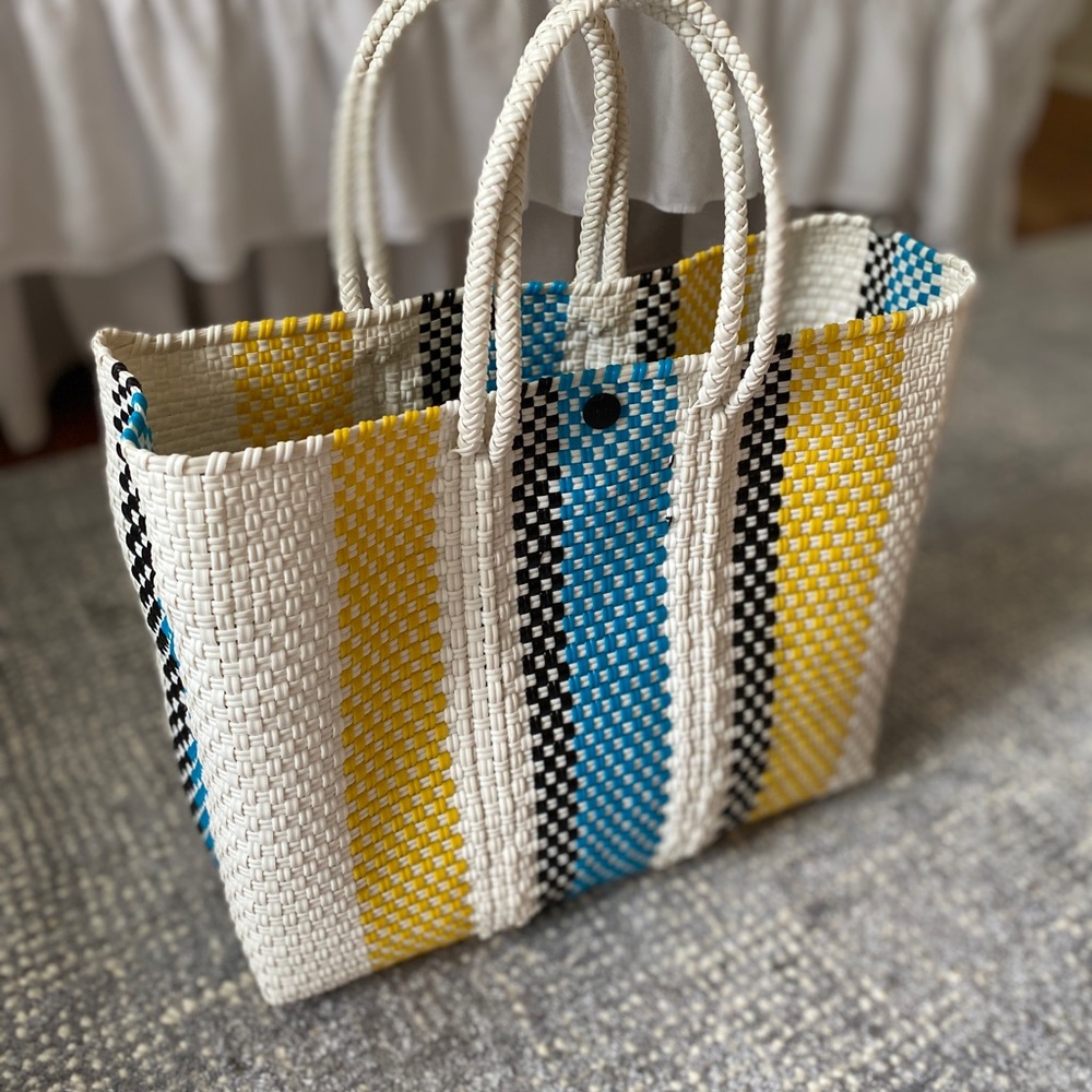 Truss small tote with leather strap.